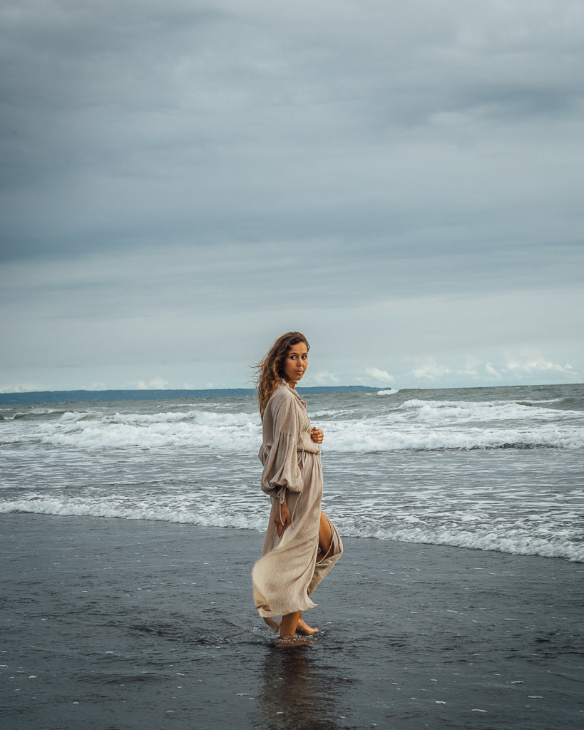 girl in dress on beach