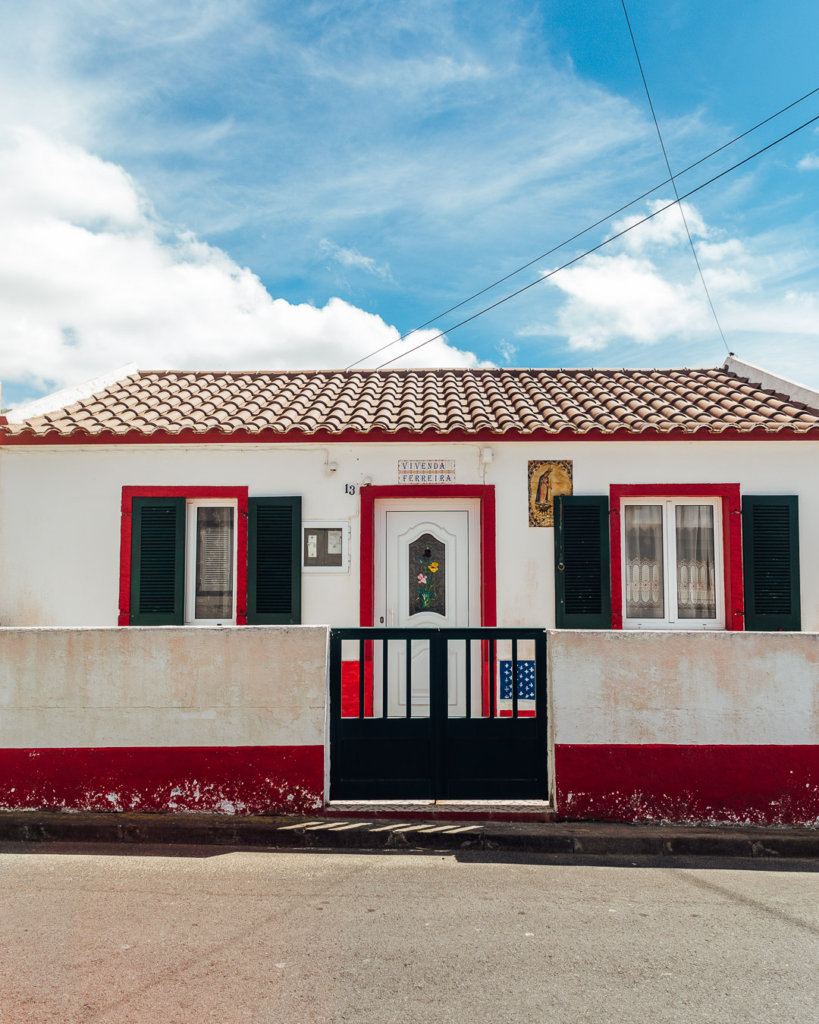 Red and white house on Sao Miguel tours through the island