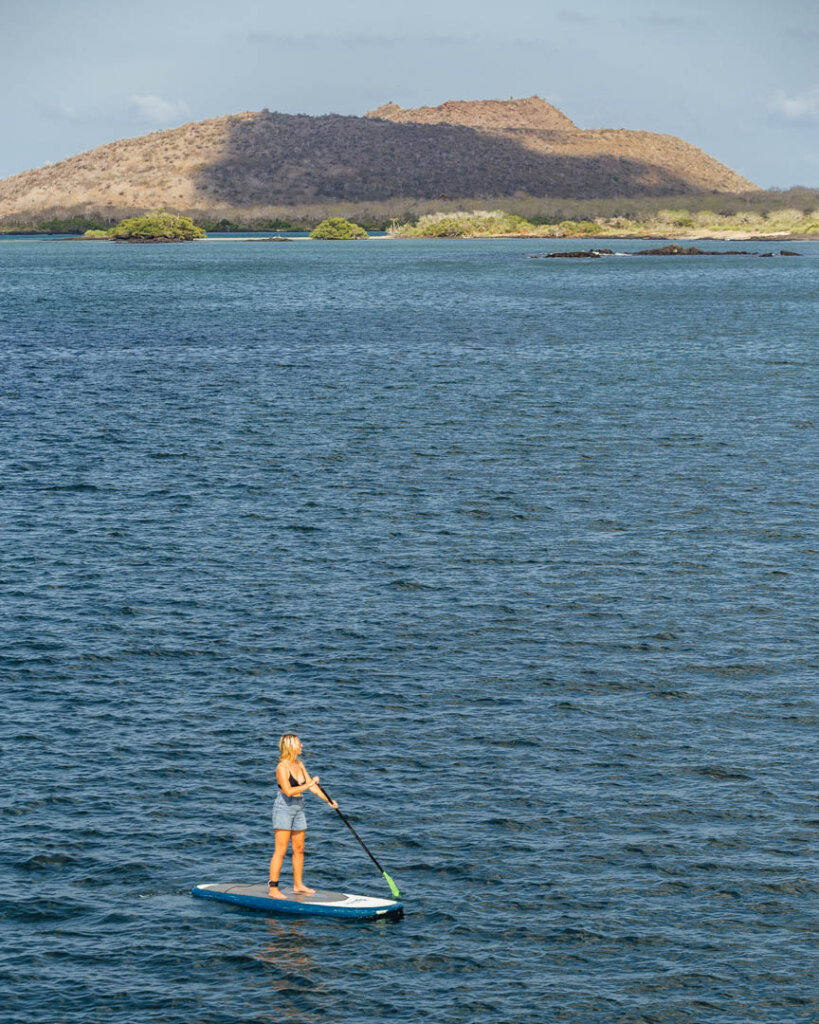girl on SUP in Galapagos Island at Cormorant point on Galapagos Islands itinerary
