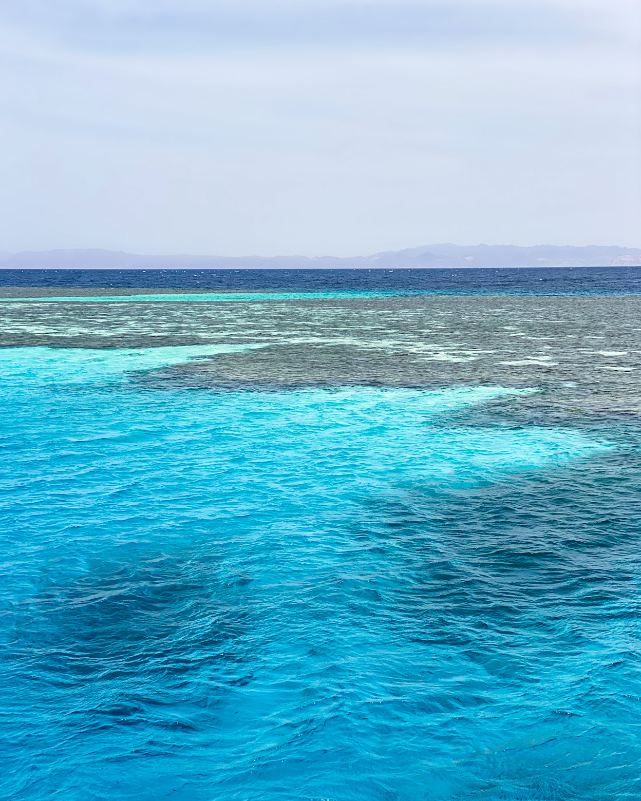 Serene view of the breathtaking turquoise reef in Dahab, Egypt.