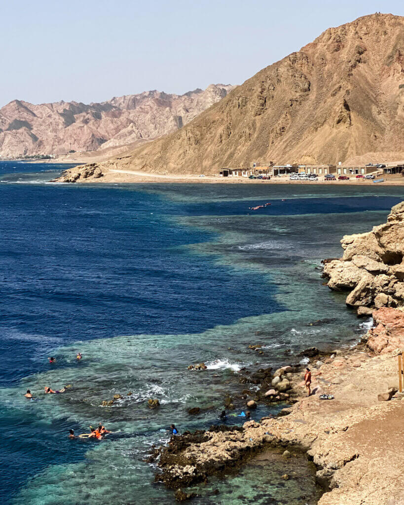 Divers exploring the underwater wonders of Blue Hole in Dahab, Egypt.