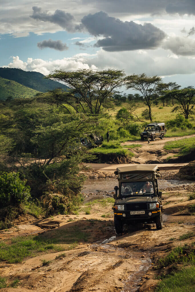 Safari vehicle on a game drive in Masai Mara