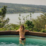 Relaxing boat ride on Lake Muhazi surrounded by lush greenery