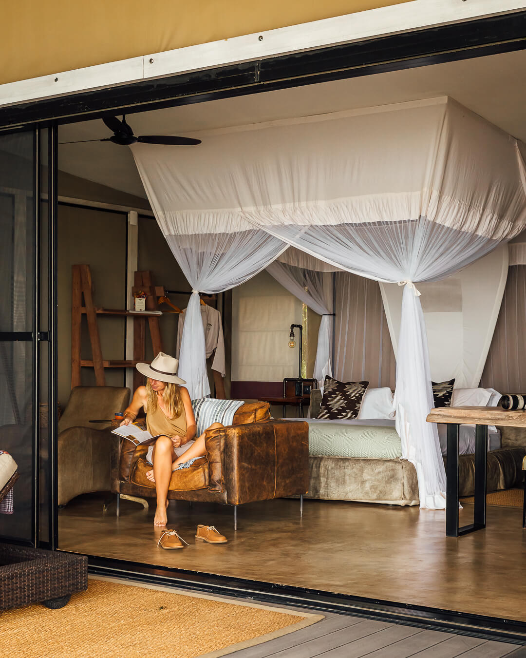 King size bed in a luxury safari tent, Sausage Tree Camp Zambia
