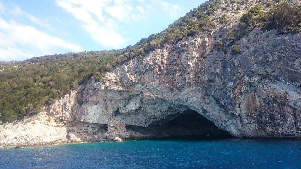 Papanikolis Cave Meganisi Greece turquoise water limestone walls