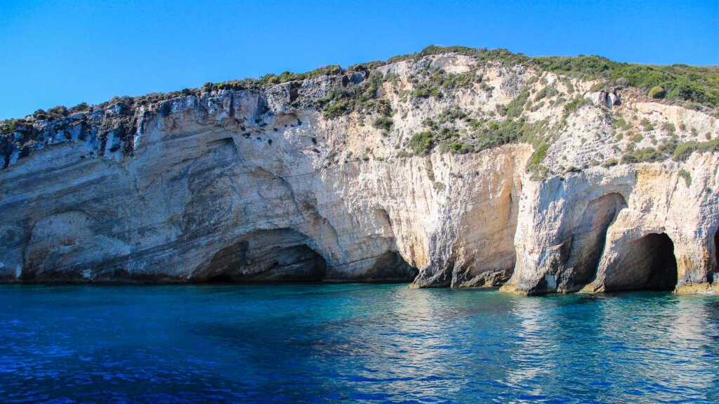 Blue Caves Zakynthos Greece electric blue water white limestone
