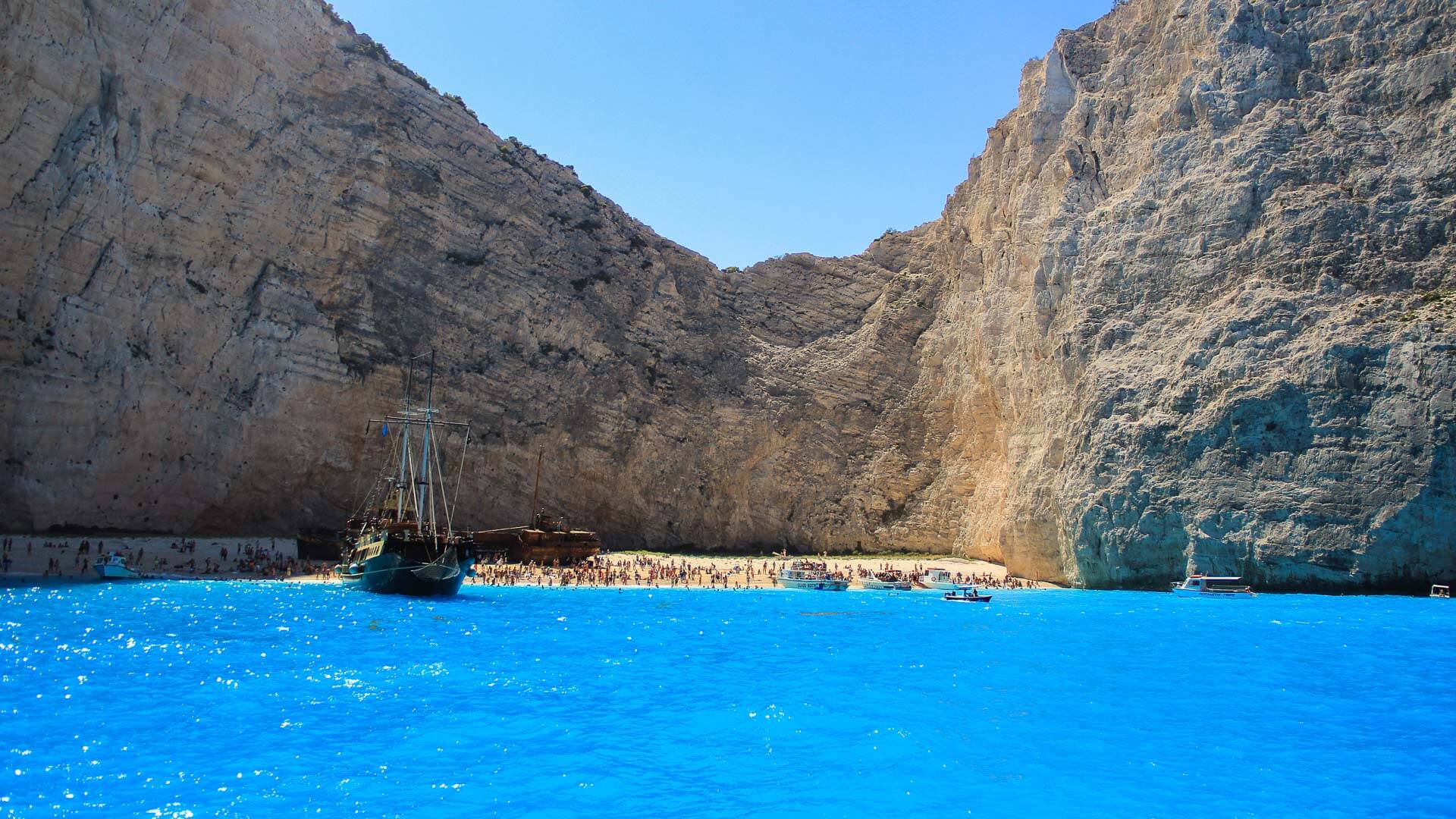 Navagio Shipwreck Beach Zakynthos rusted vessel white pebble limestone cliffs