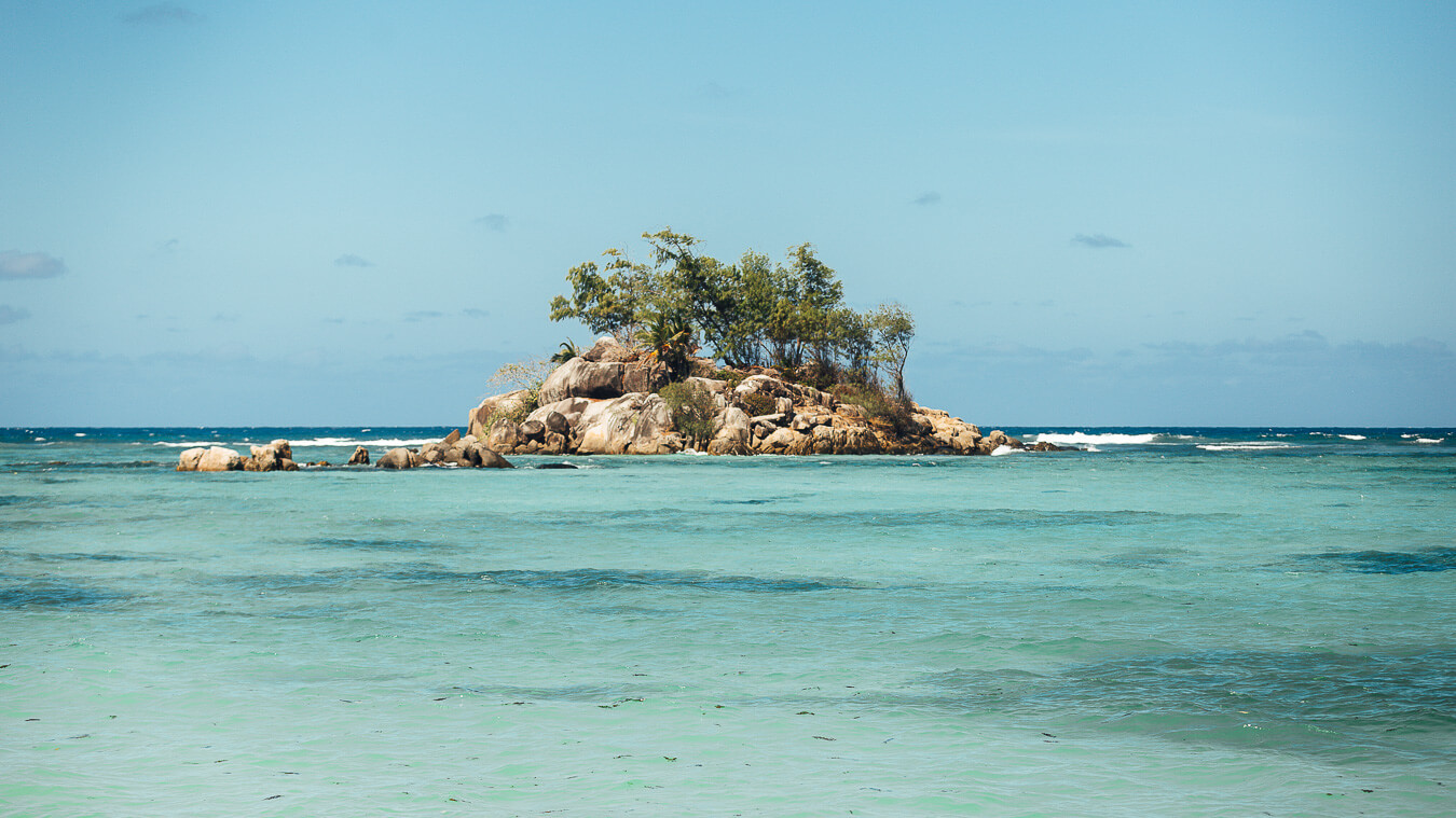 Fairyland Beach is a particularly scenic cove near Anse Royale, with granite rocks and views towards Île Souris.