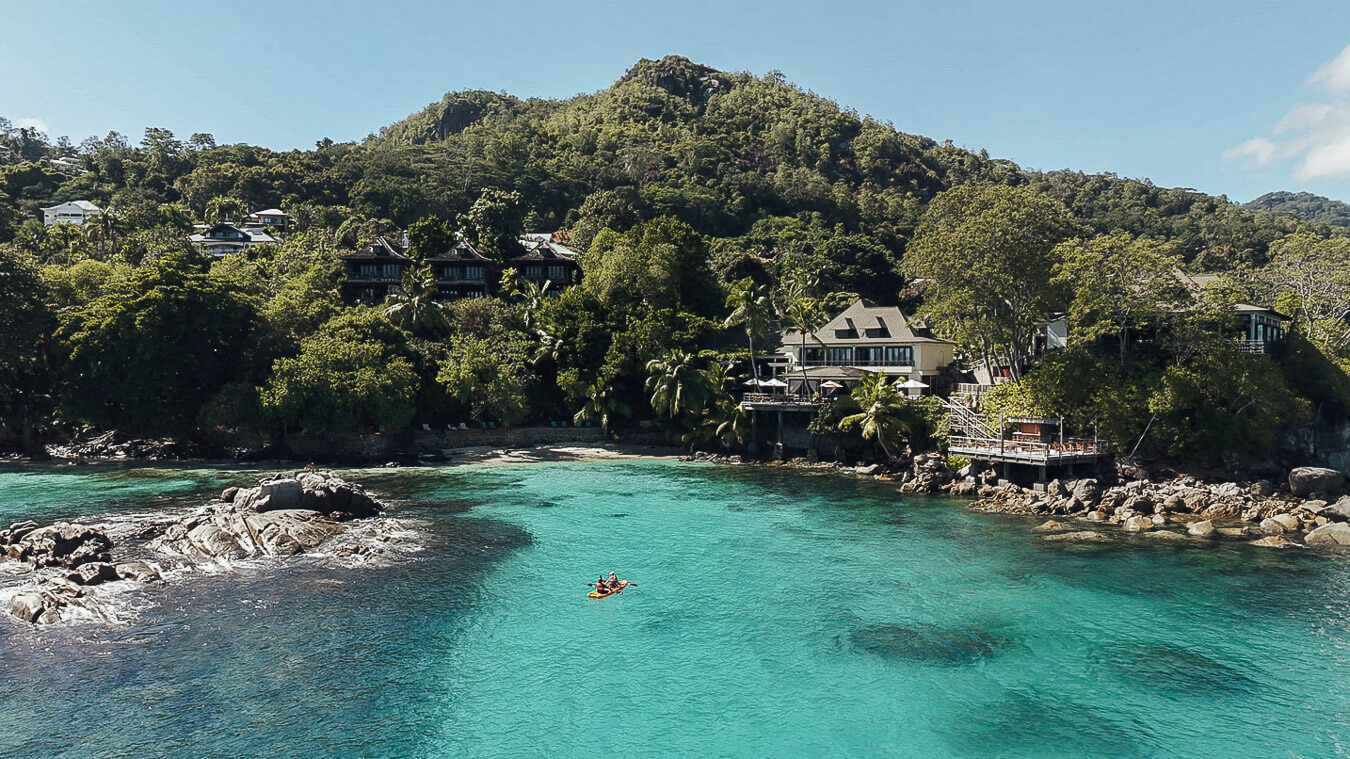 Hilton Seychelles Northolme Resort & Spa surrounded by tropical greenery overlooking the Indian Ocean